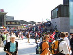 The square in front of the train station (left building) is packed with people, and this is only the beginning...